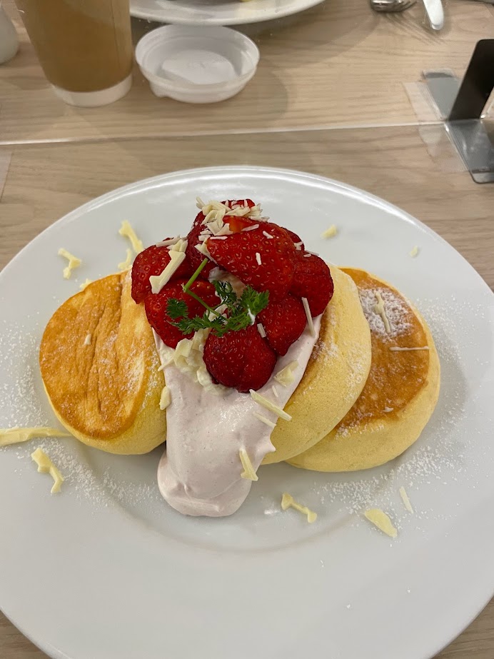 Japanese souffle pancakes with strawberries, cream, and white chocolate
