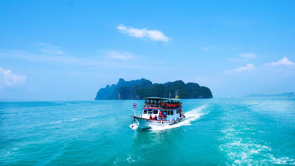 a boat takes tourists island hopping